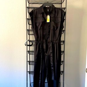 This is Max studio jump suit brand new never worn great Peace holidays event.